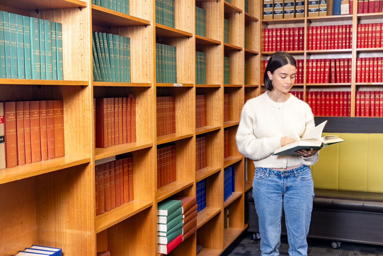 Student reading a book in the Library