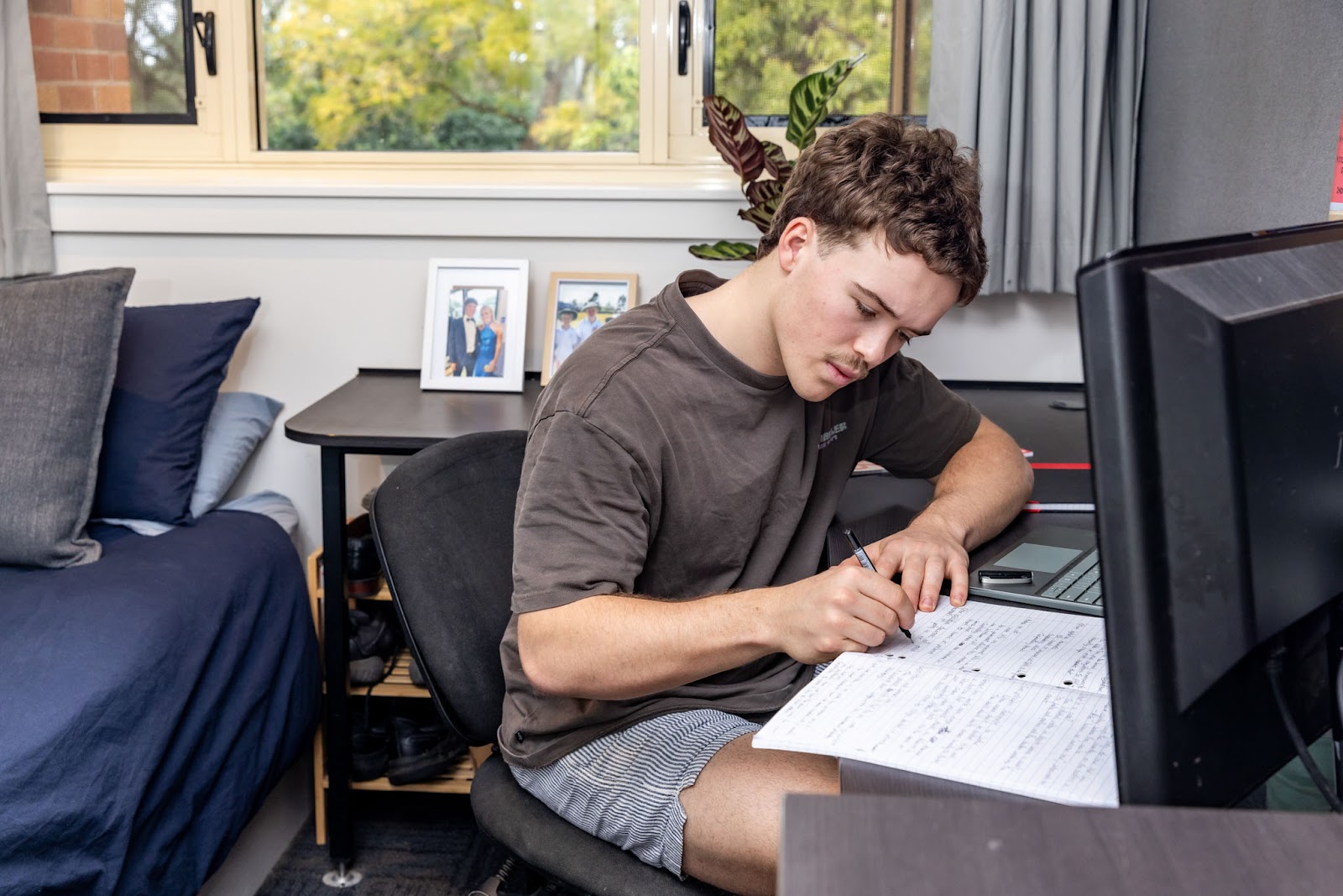 Student studying writing in their notebook