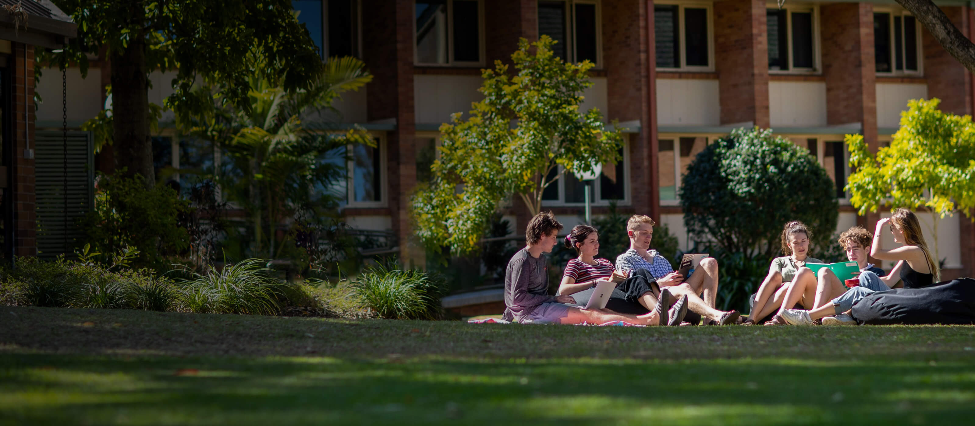 St John's students enjoying the sunshine in the college grounds