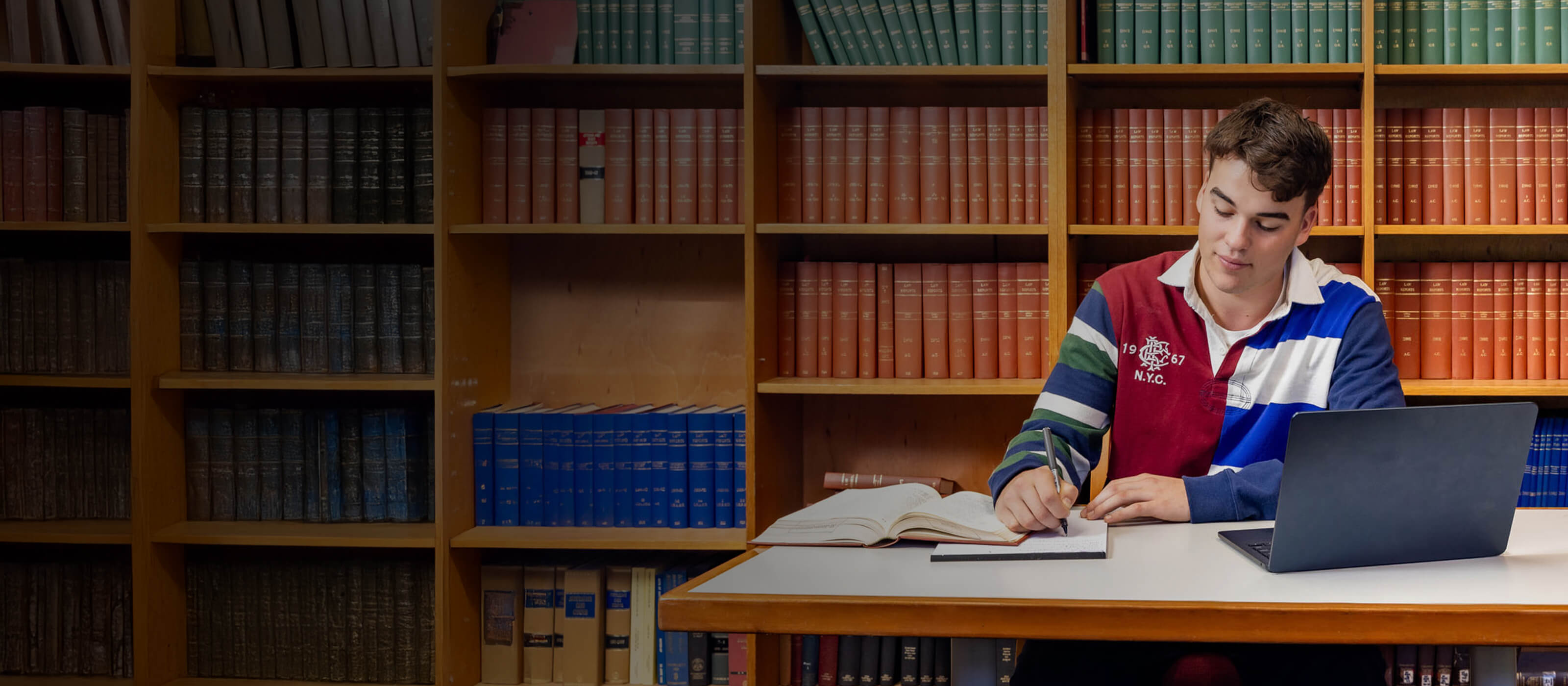 St John's student studying in the library