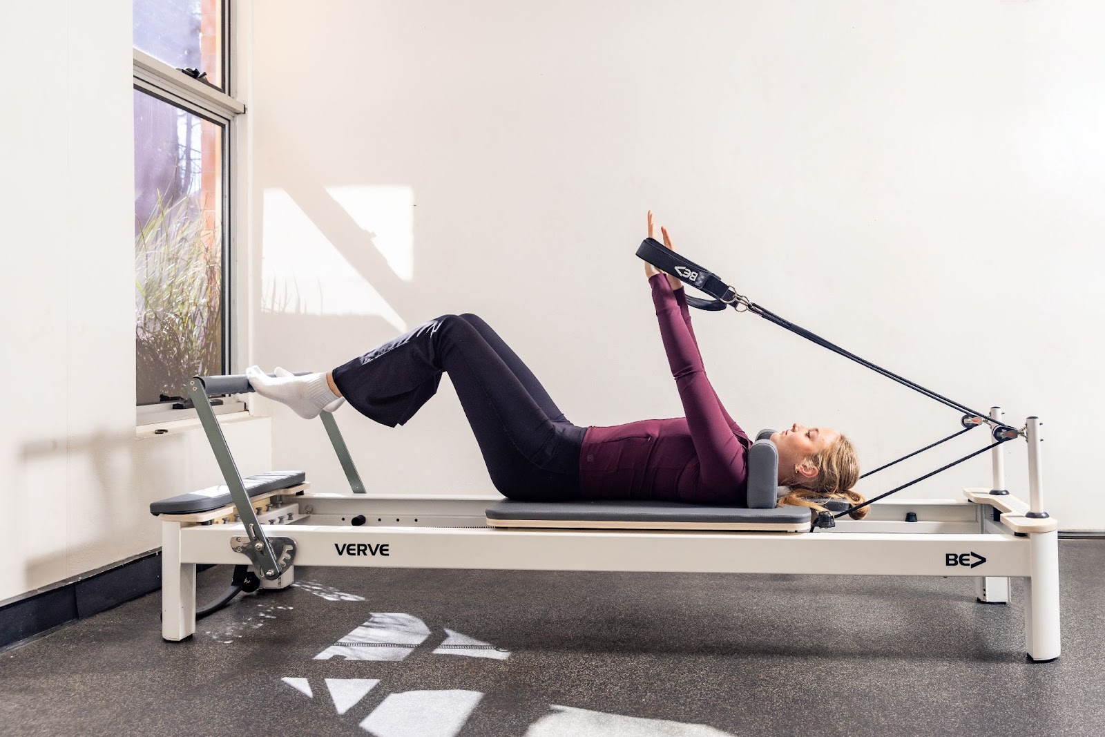 Student using the reformer machine